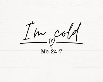 May include: Black and white typography on a white wood background. The text reads "I'm cold Me 24:7" with a small heart symbol between the words "I'm" and "cold".