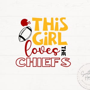 May include: A graphic design with the text "THIS GIRL loves THE CHIEFS" in yellow, red, and black. It includes a red football helmet and a football. The design is on a white background with a wood grain pattern.