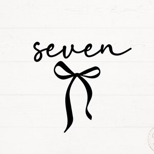 May include: Black cursive text that reads "seven" with a black bow below it. The background is white with a wood grain pattern. The lower right corner has a small circular logo with text.