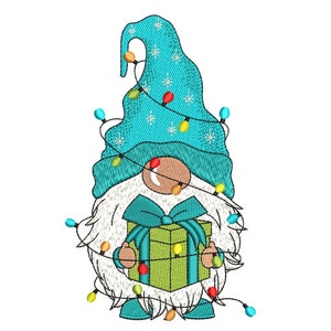 May include: A blue and white gnome with a white beard holding a green gift box with a blue bow. The gnome is surrounded by a string of colorful lights.