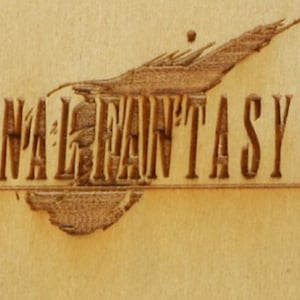 May include: A wooden carving of the "Final Fantasy VII" logo. The logo features the game's title in a stylized font, with a detailed illustration above. The carving is in shades of brown.