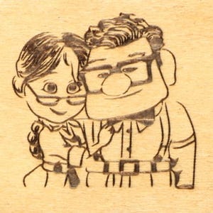 May include: A wood-burned image of a cartoon couple, both wearing glasses and smiling. The man has thick-rimmed glasses and a button-down shirt. The woman has a braided hairstyle. The image is on a light-colored wooden surface.