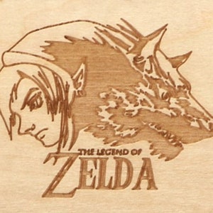 May include: A wood-burned image featuring a character from The Legend of Zelda, alongside a wolf. The text "THE LEGEND OF ZELDA" is below the image. The artwork is in shades of brown and tan.