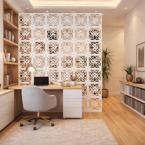 May include: A modern home office with a light wood desk, a gray swivel chair, and a white three-drawer cabinet. A laptop sits on the desk, and a decorative white screen with a floral pattern divides the space. A rug and a bookshelf complete the room.