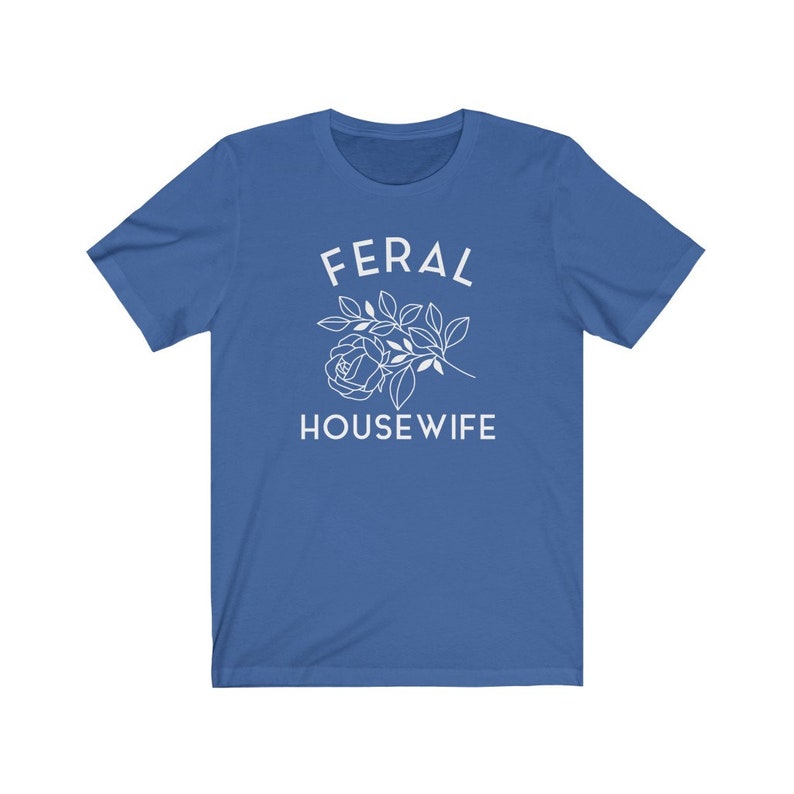 May include: A royal blue t-shirt with white text that reads "FERAL HOUSEWIFE" and a stylized white rose.