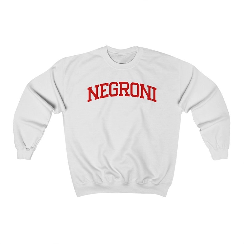 May include: White sweatshirt with red text that reads "NEGRONI" in a collegiate font.