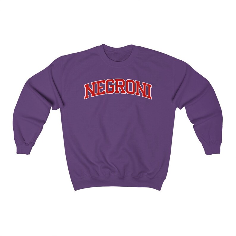 May include: Purple sweatshirt with the word "NEGRONI" in red letters.