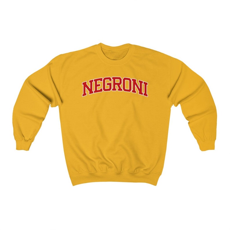 May include: A yellow sweatshirt with the word "NEGRONI" printed in red on the front.