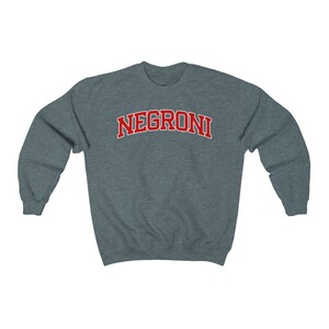 May include: A dark gray sweatshirt with the word "NEGRONI" printed in red on the front.