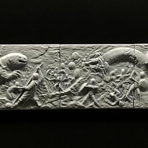 May include: A white, detailed, 3D printed relief sculpture depicting a scene of a battle between humans and a large, serpentine creature. The sculpture is divided into five sections, each showing a different part of the battle.