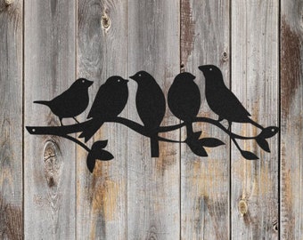 May include: Black metal silhouette of five birds perched on a branch with leaves. The birds are facing different directions and have a simple design.