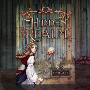 May include: A book cover titled The Hidden Realm by JD Blake featuring an illustration of a person with long wavy hair wearing a white blouse with red embroidery and a red cape, holding a staff topped with a skull in a dense forest setting.