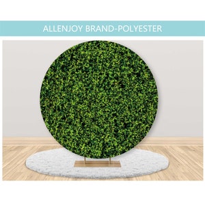 May include: A green leafy round backdrop for photography. The backdrop is made of polyester and is perfect for creating a natural, outdoor look for photos.