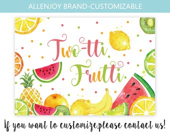 May include: A colorful printable sign with the text "Twe-tti Frutti" in pink and green lettering. The sign is decorated with a variety of fruits, including watermelon, lemons, limes, oranges, pineapples, bananas, and kiwi. The background is white with pink and green polka dots.