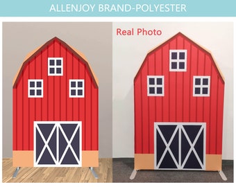 May include: Red barn backdrop with a white door and windows. The backdrop is made of polyester and has a brown base.