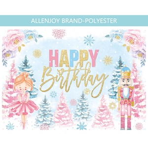 May include: A festive backdrop with a winter theme, featuring a ballerina, nutcracker, and text that reads "HAPPY Birthday" in gold glitter. The background is light blue with pink and blue floral accents and snowflakes. The backdrop is made of polyester.