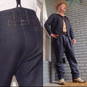 May include: A pair of dark blue denim pants with a wide leg and a high waist. The pants have a belt loop and a buckle closure. The pants are worn with a white shirt and a denim jacket.