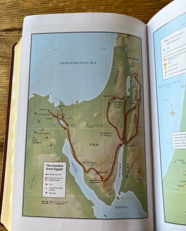 May include: Open book page with a detailed map illustrating "The Exodus from Egypt." The map features a red route tracing the journey, with labels for locations like Goshen, Sinai, and the Red Sea. The map is surrounded by text and geographical details.