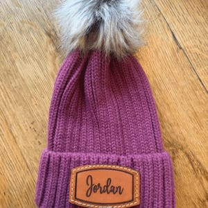 Custom Monogram Beanie Hat Personalized Leather Patch Name Embroidered Winter Wedding Bridesmaid Gift Warm Pom Knit Cuffed Acrylic Material Adjustable Fit Cozy Headgear Fashion Accessory Bridal Party Wear Premium Quality Construction