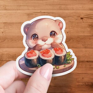 Schattige otter etende sushi gestanste sticker, waterdicht en gelamineerd, perfect voor laptops, tijdschriften en waterflessen, schattig ottercadeau