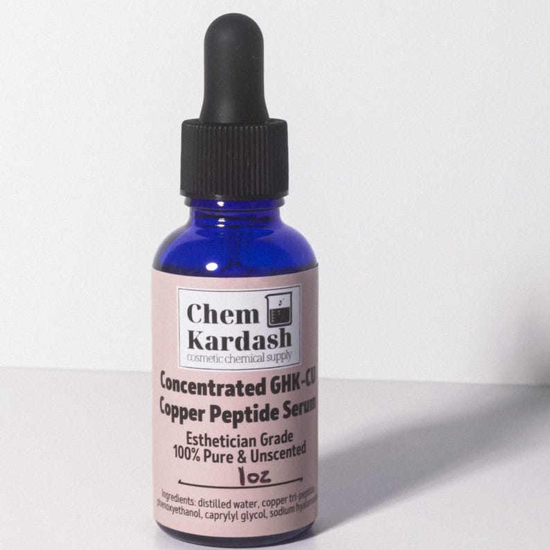 May include: A cobalt blue glass bottle with a black dropper. The label reads "Chem Kardash" and "Concentrated GHK-Cu Copper Peptide Serum." The label also states "Esthetician Grade 100% Pure & Unscented" and "1 oz."