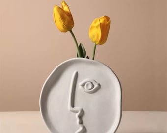 Flower vase face art