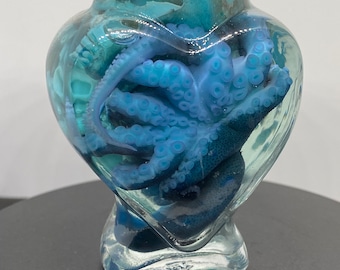 Blue stained little bit wonky group of three Octopus wet specimens in glass heart jar