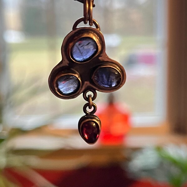 Iolite and Garnet Cabochon Freeform Pendant. Sterling and Fine Silver. 1 1/2” x 7/8. Handcrafted