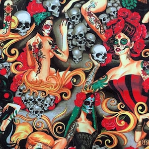May include: A colourful fabric with a Day of the Dead theme. The fabric features three women with sugar skull makeup, red roses, and skulls. The fabric is perfect for crafting projects like clothing, bags, and home decor.