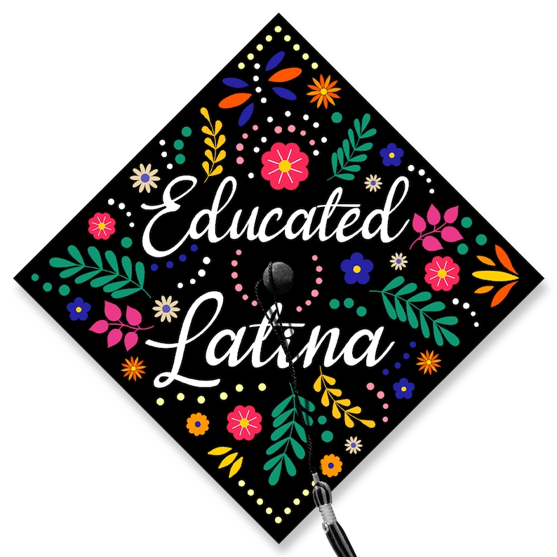 May include: Black graduation cap with a colorful floral design and the text "Educated Latina" in white.