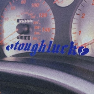 May include: A close-up of a car's dashboard with a speedometer reading 130 mph. The text "tough luck" is written in blue on the dashboard.
