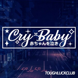 May include: A rectangular graphic with the words "Cry Baby" in a cursive font, with Japanese text below. The background is a nighttime street scene with the words "TOUGHLUCKCLUB" at the bottom.