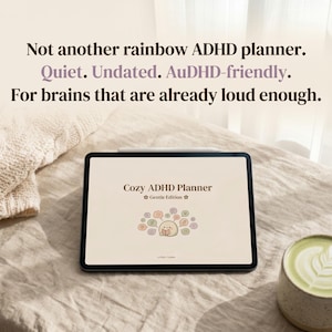 May include: A digital tablet displaying a planner titled "Cozy ADHD Planner Gentle Edition." The tablet is on a beige surface with text above that reads "Not another rainbow ADHD planner. Quiet. Undated. AuDHD-friendly. For brains that are already loud enough."