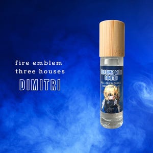 May include: A clear glass roll-on fragrance bottle with a light wood cap. The label reads "TEATIME WITH DIMITRI" and features an anime-style illustration. The background is a gradient of blue with white wisps, and the text "fire emblem three houses DIMITRI" is also present.