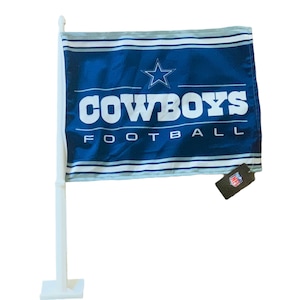 May include: A blue and white car flag with the Dallas Cowboys logo and the words "COWBOYS FOOTBALL".