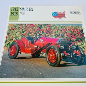 May include: A red 1912 Simplex 75 HP car, a vintage automobile, is parked in front of a red rose bush. The car is a classic example of early 20th-century automotive design. The image is from a vintage car card, with the text "1912 Simplex 1915 75 HP" and "SPORTS" printed on the card.