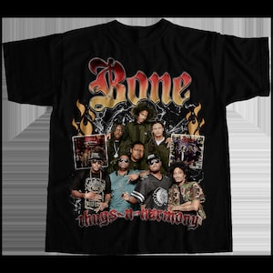 May include: Black t-shirt with a vintage-style graphic of the hip-hop group Bone Thugs-n-Harmony. The graphic features the group's name in a stylized font with flames and a cracked glass effect. The members of the group are pictured in the graphic, along with album covers.