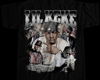 May include: Black t-shirt with a vintage-style graphic of Lil Keke, a rapper, surrounded by other people and a car. The text "Lil Keke" is in large, bold letters at the top of the graphic.