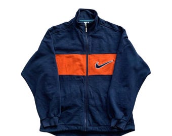 Sudadera Nike vintage con cremallera completa y logo central bordado en azul marino Sudadera retro de los años 90 con cuello redondo y detalle en la espalda
