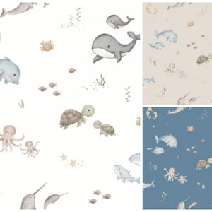 Könnte beinhalten: Aquarellillustrationen von Meereslebewesen, darunter Wale, Delfine, Schildkröten und Oktopusse, auf weißem Hintergrund. Das Design umfasst verschiedene Meeresbewohner und Wasserpflanzen, die eine Unterwasserszene schaffen.