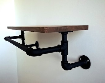 Loft hanger shelf with plumbing pipes