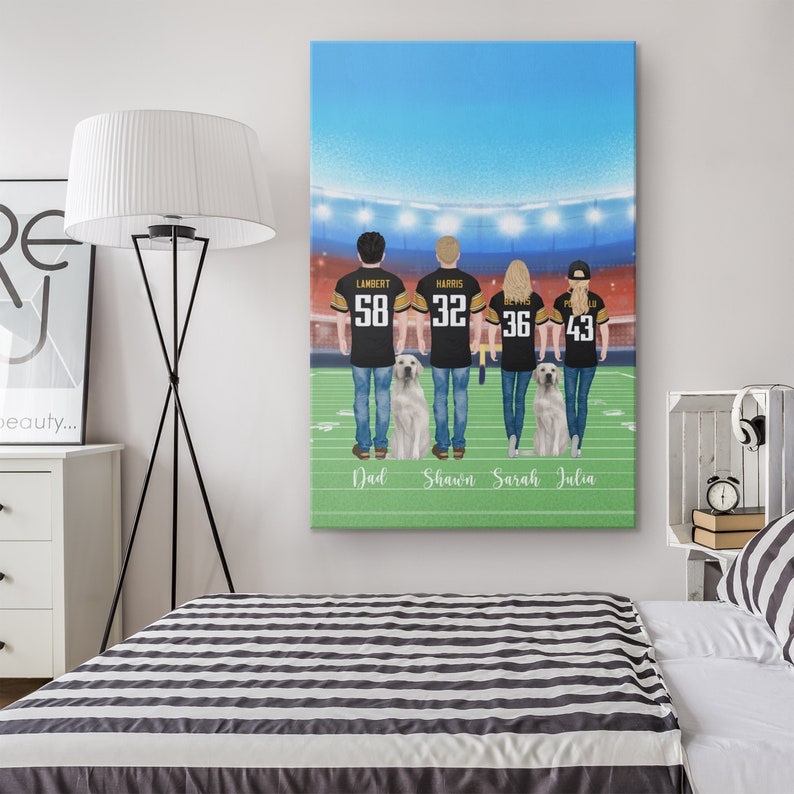 May include: A personalised canvas print featuring a family of four in football jerseys standing with two dogs in front of a stadium backdrop. The jerseys have the names "Lambert", "Harris", "Beyers", and "Powell" and the numbers "58", "32", "36", and "43". The names "Dad", "Shawn", "Sarah", and "Julia" are written below the figures.
