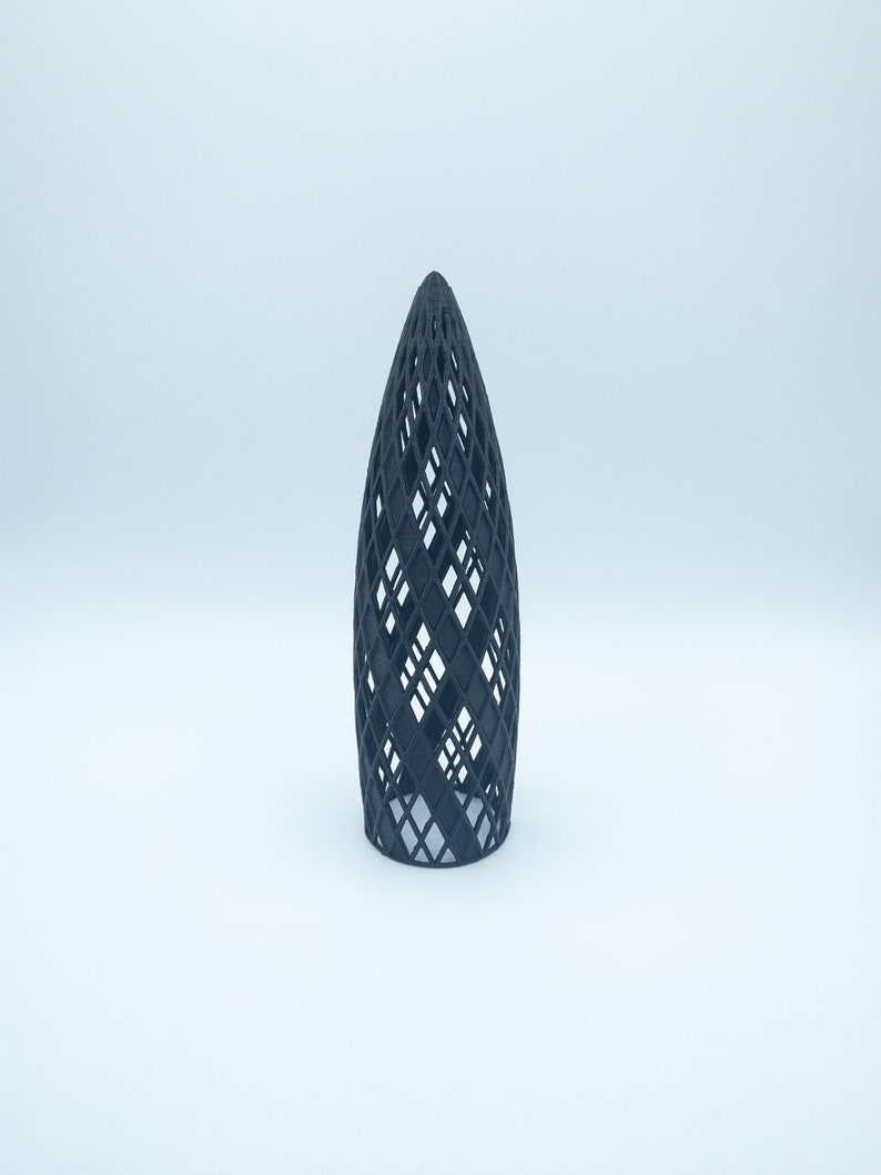 May include: A black 3D printed model of a building with a geometric design. The model is a hollow structure with a lattice-like pattern.
