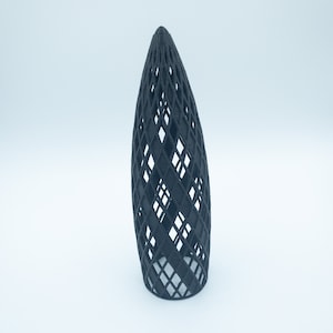 May include: A black 3D printed geometric object with a diamond pattern. The object is shaped like a cone and has a hollow center.
