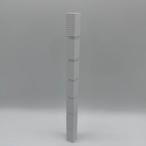 May include: A grey architectural model of a skyscraper. The building is rectangular with a grid pattern of windows. The model is a light grey colour and stands upright against a plain white background.