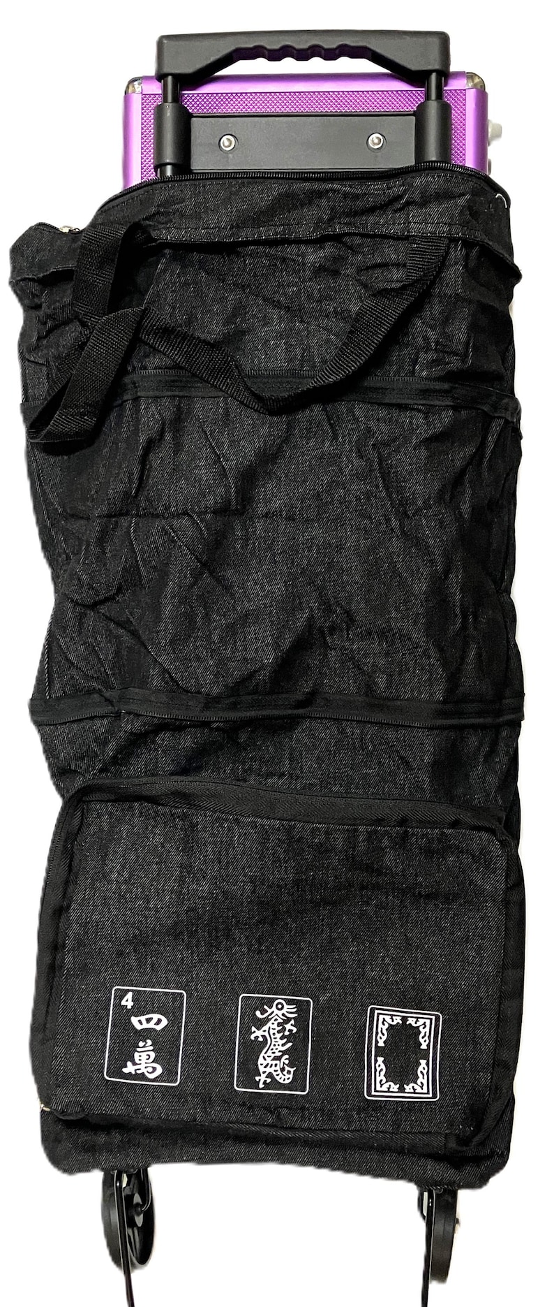 May include: Black rolling tote bag with a purple accent. The bag has a telescoping handle and wheels for easy transport. The front of the bag features three white graphic designs. A practical and stylish travel accessory.