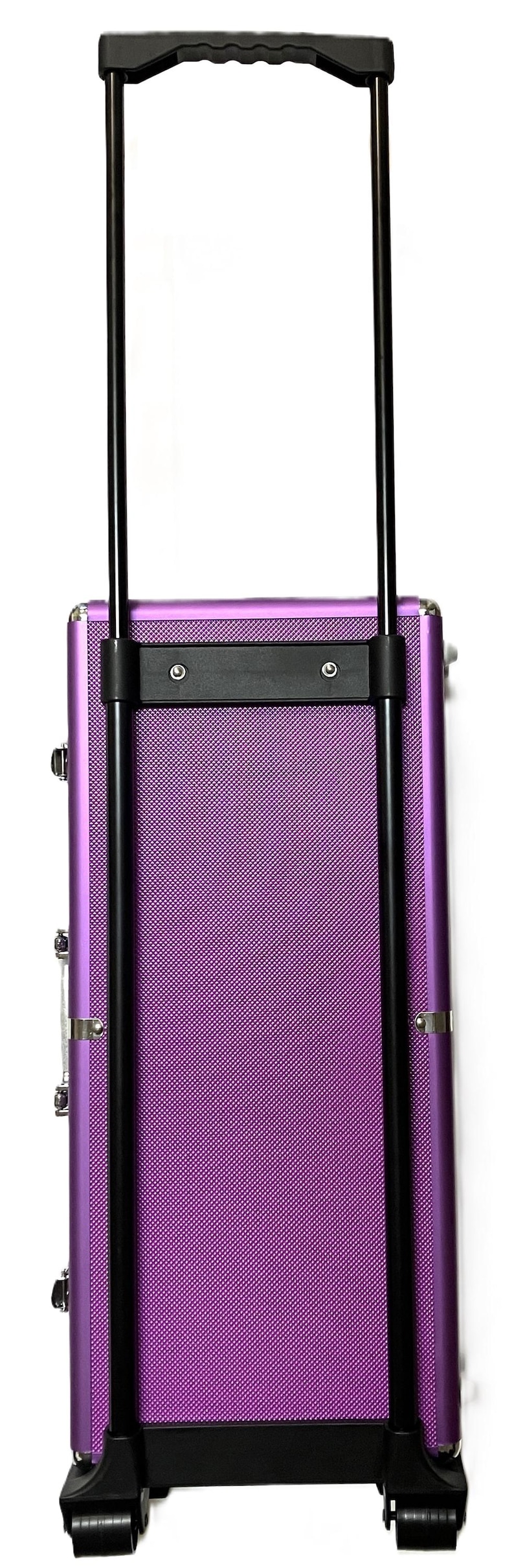 May include: A purple rolling makeup case with a textured surface and black handle. The case has a telescoping handle and wheels for easy transport. The case is designed for cosmetics and beauty supplies.
