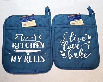Set of 2 aqua color 9" x 7" polyester pot holder with rubber backing 1. My Kitchen My rules 2. Live Love Bake