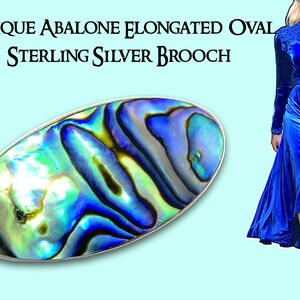 May include: Antique elongated oval sterling silver brooch with abalone shell inlay. The brooch features iridescent blues, greens, and yellows within a silver frame. The text "ANTIQUE ABALONE ELONGATED OVAL STERLING SILVER BROOCH" is at the top.