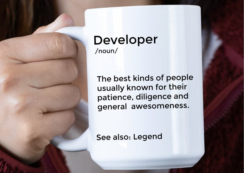 May include: White ceramic mug with a black design that reads "Developer /noun/ The best kinds of people usually known for their patience, diligence and general awesomeness. See also: Legend"
